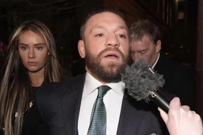 McGregor's partner Dee Devlin appeared tearful as they left court