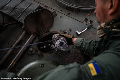 Ukrainian servicemen from the 33rd Brigade maintains his Leopard 2A4