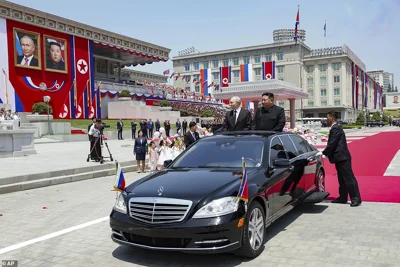 Russian President Vladimir Putin, left, and North Korea's leader Kim Jong Un, right, arrive to attend the official welcome ceremony in the Kim Il Sung Square in Pyongyang, North Korea, on Wednesday, June 19, 2024