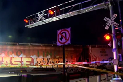One child dead and another injured after train hits family on railroad bridge, killing two adults