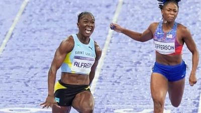 Julien Alfred, of Saint Lucia, crosses the finish line ahead of Melissa Jefferson, of the United States, to win the women's 100 meters final at the 2024 Summer Olympics(AP)
