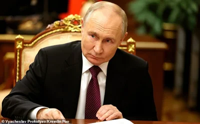 Russian President Vladimir Putin, listens to a report by First Deputy Prime Minister Denis Manturov, during a one-on-one meeting at the Kremlin, November 20, 2024