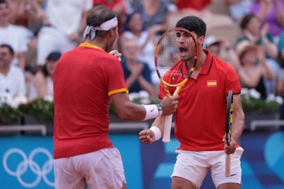 Paris 2024 Olympics - Tennis - Men's Doubles Second Round - Roland-Garros Stadium, Paris, France - July 30, 2024. Carlos Alcaraz of Spain and Rafael Nadal of Spain react during their match against Tallon Griekspoor of Netherlands and Wesley Koolhof of Netherlands. REUTERS/Claudia Greco