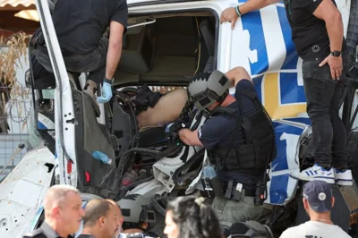 Israeli police inspect the truck at the site of a ramming attack in Ramat Hasharon, north of Tel Aviv