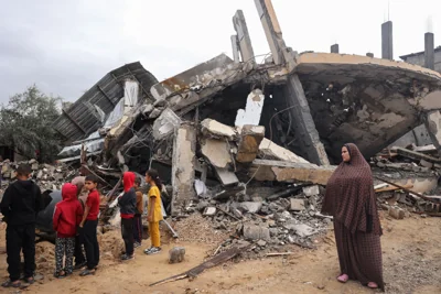 Palestinians inspect the destruction following overnight Israeli strikes on Rafah in the southern Gaza Strip on 6 May