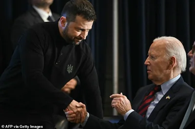 Ukrainian President Volodymyr Zelensky shakes hands with US President Joe Biden