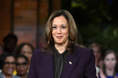 Vice President Kamala Harris poses during the Unite for America rally in Farmington Hills, Michigan, on September 19