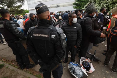 French police evict hundreds of migrants from a Paris warehouse ahead of the Olympics