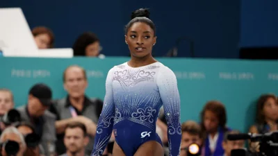 Simone Biles slips off the balance beam and fails to win gold for the first time in Paris