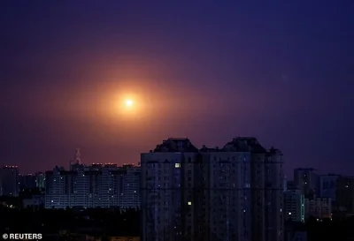 An explosion of a drone is seen in the sky over Kyiv during a Russian drone strike on July 31