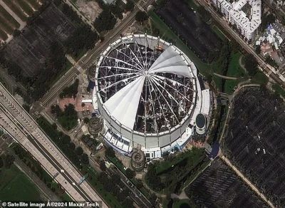 A newly released satellite image shows Tropicana Field on October 10, 2024 after Hurricane Milton ripped the roof off of the stadium