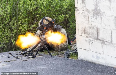 A soldier is pictured during a military exercise with Swedish and foreign military units in May