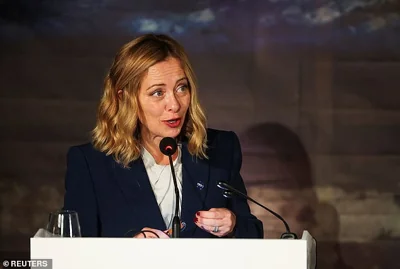 Italy's Prime Minister Giorgia Meloni is pictured speaking above