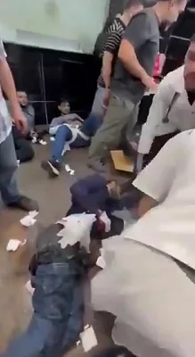 Injured people are seen lying on the floor in hospitals in Lebanon