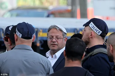 Minister of National Security of Israel, Itamar Ben Gvir looks on at the scene of a truck ramming outside the Glilot military base near Tel Aviv, Israel, 27 October 2024