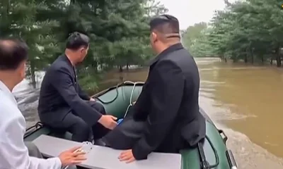 Videoclip shows the hilarious moment Kim Jong Un was forced to duck as he nearly crashed into a tree while he headed out on a boat to survey the flooded areas in North Korea