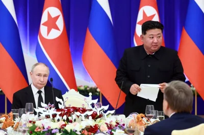 Russian President Vladimir Putin, left, and North Korea's leader Kim Jong Un attend a State Reception after their talks in Pyongyang, North Korea, on Wednesday, June 19, 2024.