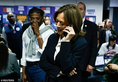 Kamala Harris calls voters in a last minute campaign push at the Democratic National Committee headquarters in Washington DC