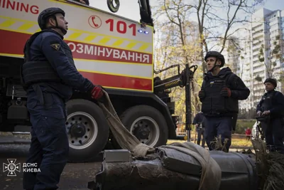 Personnel remove part of a Russian missile