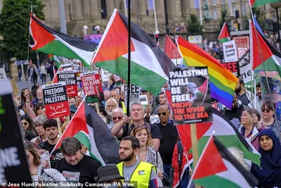 Pro-Palestine marches will 'escalate' with greater numbers on the streets of Britain if Israel continues to be granted 'impunity', a leading organiser has declared