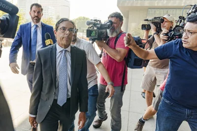 Dr. Mark Chavez, a physician from San Diego, second from left, who is charged in connection with actor Matthew Perry's death from an accidental ketamine overdose, with his criminal defense attorney Matthew Binninger, far left, arrive for a change of plea hearing at the United States Courthouse in Los Angeles on Wednesday, Oct. 2, 2024. AP PHOTO 