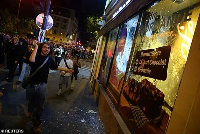 Protestors smashed up shop windows in their own city