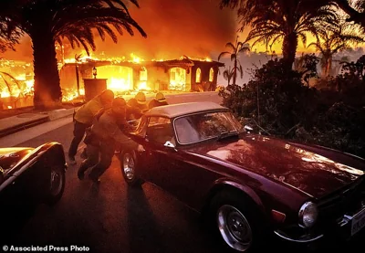 Over 14,000 people were contacted and urged to evacuate as live coal spread more than two miles away and sparked new flames