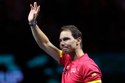 Spain's Rafael Nadal waves during a tribute to his career at the end of the quarter-final doubles match between Netherlands and Spain during the Davis Cup Finals at the Palacio de Deportes Jose Maria Martin Carpena arena in Malaga, southern Spain, on November 19, 2024. AFP PHOTO