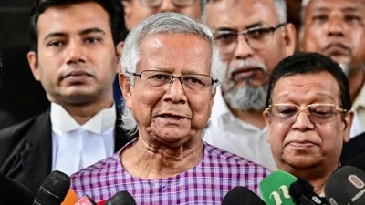 Nobel peace laureate Muhammad Yunus (C) speaks to the media after filing an appeal for the extension of his bail (File image)(AFP)