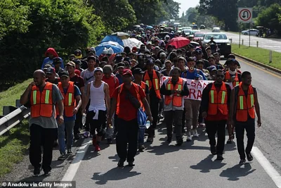 Migrants coordinates advance in a caravan heading to the United States, in Tapachula, Mexico, on November 5, 2024