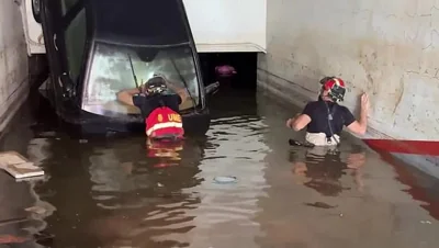 Rescuers continue to search for survivors with fears underwater car parks will be 'mass graves'