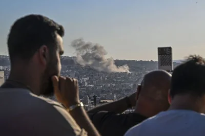 Smoke rises after an airstrike on Dahieh in southern Beirut