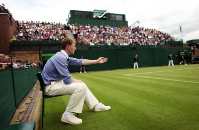 A line judge makes a decision on court 18 at Wimbledon