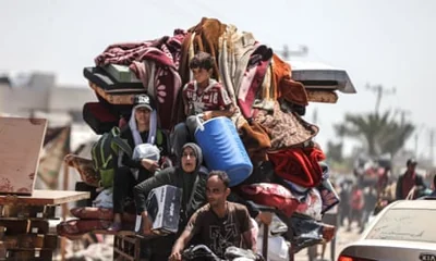 Palestinians flee with their belongings from the al-Mawasi area of western Rafah, Gaza, on Friday amid Israeli shelling