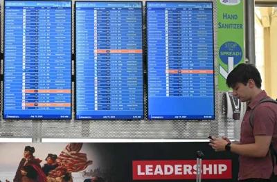 Departure monitors show canceled and delayed flights at Ronald Reagan Washington National Airport on July 19, in Arlington, Va., during a major worldwide computer systems outage. AFP-Yonhap