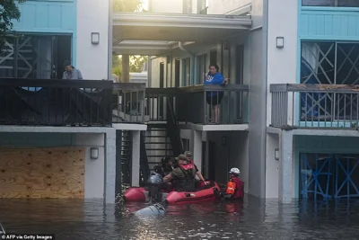 Residents who remained in the southern state during the historic storm had no choice but to be rescued by disaster relief personnel as their second story apartment complex in Clearwater sits under several feet of water as a result of an overflow from a nearby creek