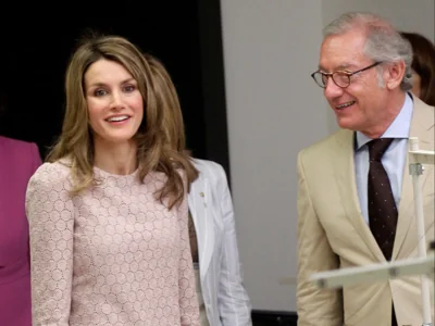 Isak Andic, Chief Executive of Spanish fashion label Mango, stands next to Spanish Princess Letizia during her visit to a factory near Barcelona