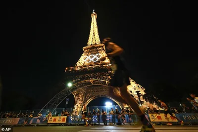 The Eiffel Tower has been evacuated after a man was seen climbing the iconic Paris landmark hours before the Olympics closing ceremony