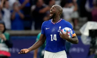 Jean-Philippe Mateta of France holds the ball as he celebrates scoring against Spain.