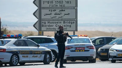 Israeli police stand guard near the site of a shooting attack where officials say three people doed at the Allenby Bridge Crossing between the West Bank and Jordan on Sept. 8.