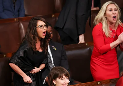 Lauren Boebert, left, and Marjorie Taylor Greene scream at Joe Biden during his State of the Union address in 2021