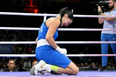 Italy's Angela Carini reacts during her women's 66kg preliminaries round of 16 boxing match against Algeria's Imane Khelif during the Paris 2024 Olympic Games at the North Paris Arena, in Villepinte on August 1, 2024. AFP PHOTO