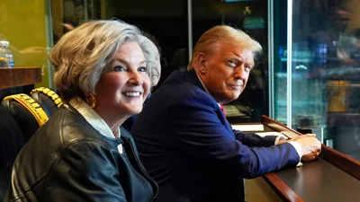 Donald Trump attends a game between the NFL Pittsburgh Steelers and the New York Jets with senior campaign consultant Susie Wiles on Oct. 20, 2024 in Latrobe, Pennsylvania.