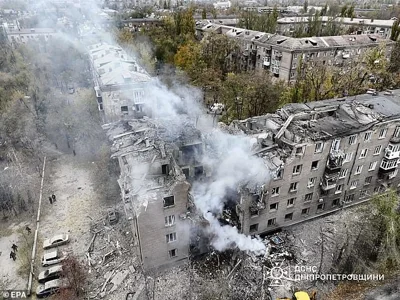 A handout picture made available by the State Emergency Service of Ukraine shows the site of a rocket attack on a five-story residential building in Kryvyi Rih, Ukraine, 11 November 2024