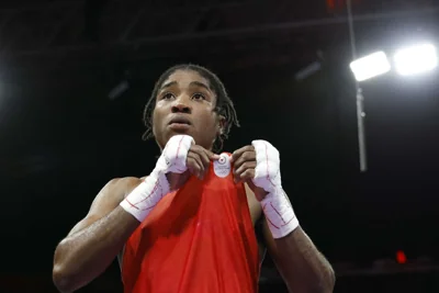 Boxer Cindy Ngamba wins Refugee Olympic Team's first medal ever
