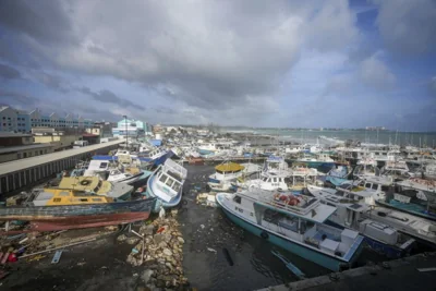 Fishing vessels lie damaged after Hurricane Beryl passed through the Bridgetown Fisheries in Barbados