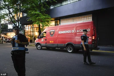 Police stand guard outside CasaSur Palmero Hotel where Liam Payne was found