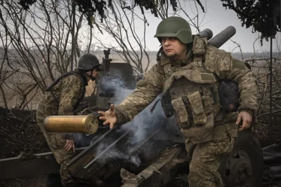 Ukrainian soldiers with the 71st Jaeger Brigade fire a M101 howitzer at Russian positions on the front line, near Avdiivka in Ukraine's Donetsk region, 22 March 2024