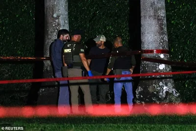 Officials said U.S. Secret Service agents spotted a rifle barrel sticking out of the bushes two holes ahead of where Trump was golfing on Sunday, prompting the agents to fire at the suspect