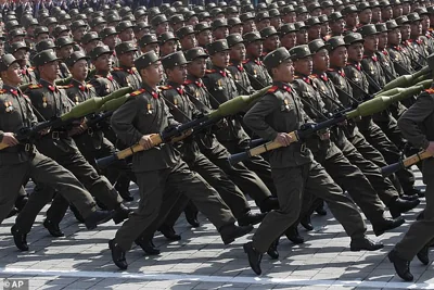 North Korean soldiers march during a mass military parade in Pyongyang's Kim Il Sung Square. Kim Jong Un has reportedly dispatched 12,000 troops to support Russia's devastating invasion of Ukraine